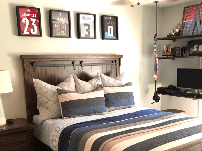 Shart T-Shirt Frames displayed above bed.  Shart T-Shirt Frames make great decoration for the home.