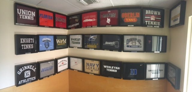 Shart T-Shirt Frame Display with College Tennis Tee Shirts framed and displayed at the John McEnroe Tennis Academy