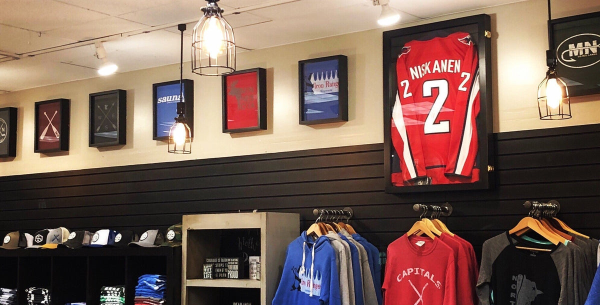 Sports Store Retail Display tee shirts framed in Shart® Original® Tee Shirt Frames